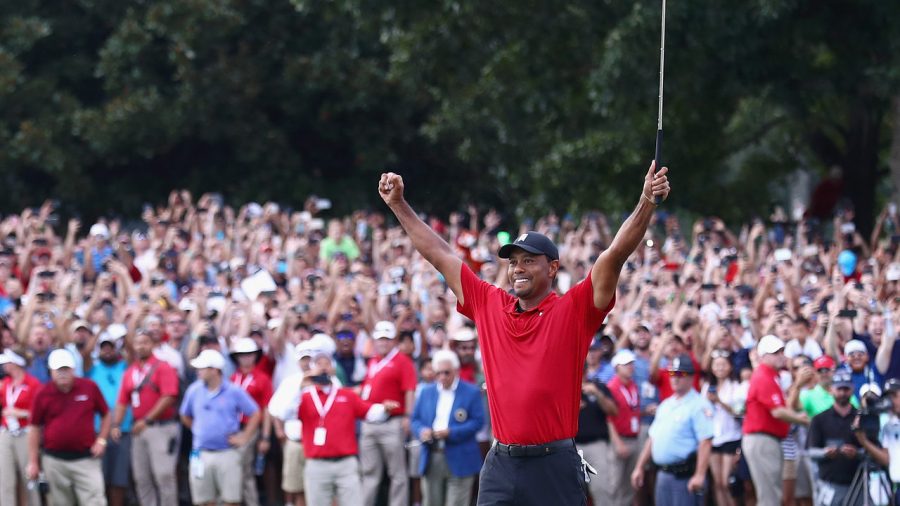 Tiger+Woods+celebrating+his+last+hole+victory.