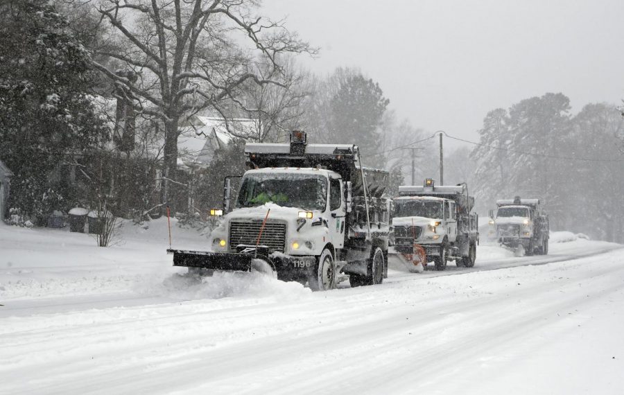 Snow trucks attempting to remove the snow out of Burlington,  NC.