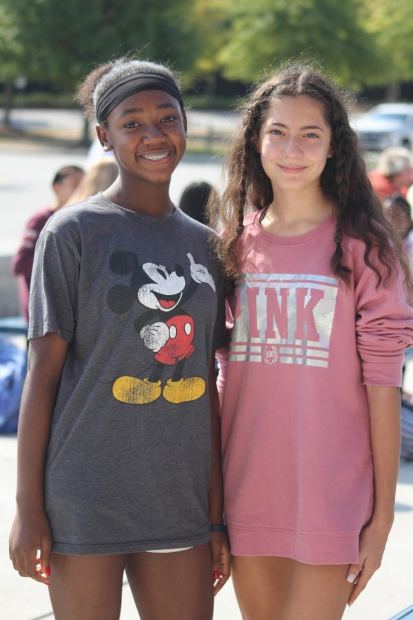 Eva Poole and Daniela Banos are wearing t-shirts that are longer then their shorts, which is a dress code violation.