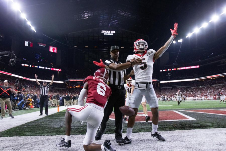 Adonai Mitchell (5)of the Georgia Bulldogs celebrates after a touchdown catch in the back corner of the endzone against Khyree Jackson(6) of the Alabama Crimson Tide