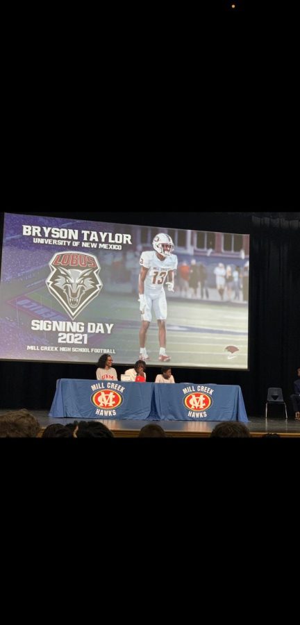 Bryson Taylor mom and little brother supporting him at Signing day.