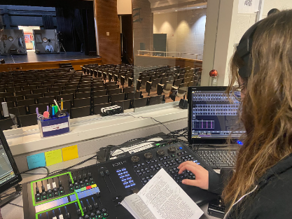 KT Lambright, 12, managing the tech booth for Mill Creeks theater production of The Hobbit.