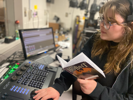 KT Lambright, 12, managing the tech booth for Mill Creeks theater production of The Hobbit.