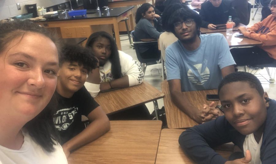 During an iLead tutoring session, Emma Davis, 12, and Vinay Honne, 12, help Brandon Aiken, 9, Layla Gill, 9, and Matthew Moses, 9, with their studies and give them advice concerning their classes.