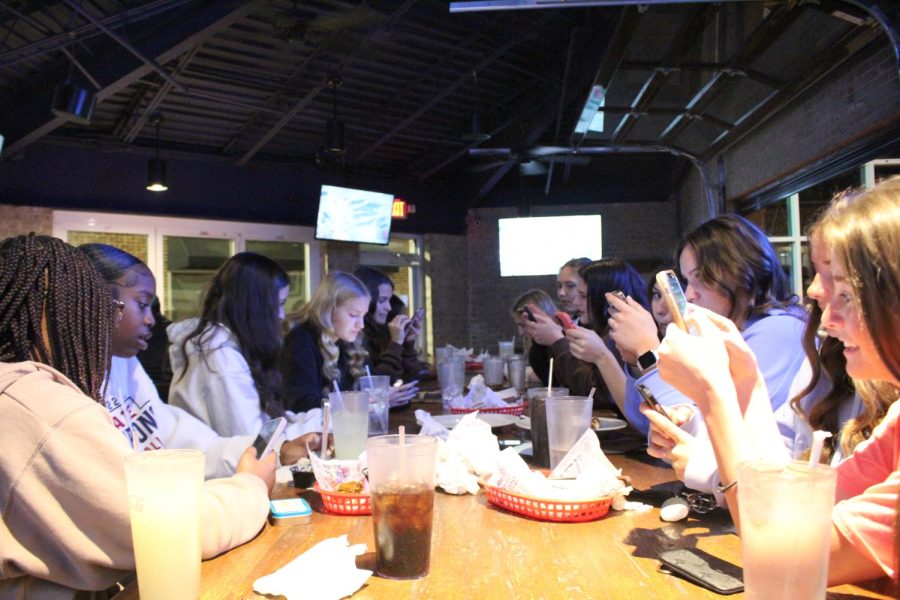 JV girls soccer team enjoying dinner. 