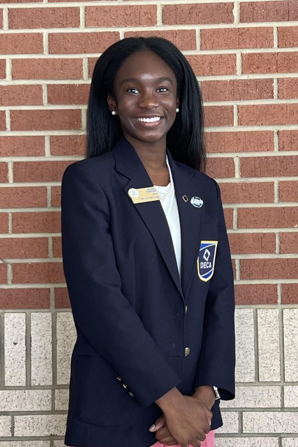 Pearl Yeboah, 10, in DECA uniform posing for her officer photo.