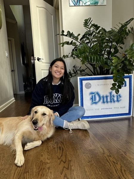 Chelsea Nguyen, 12, posing for a photo announcing her acceptance to Duke University