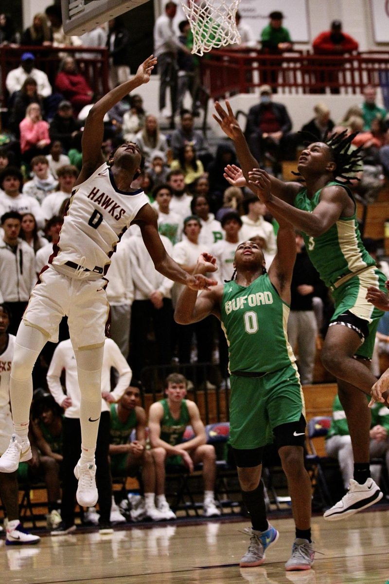 Stephen Jackson, 12,  jumping and making a scoring basket during a match up against Buford.