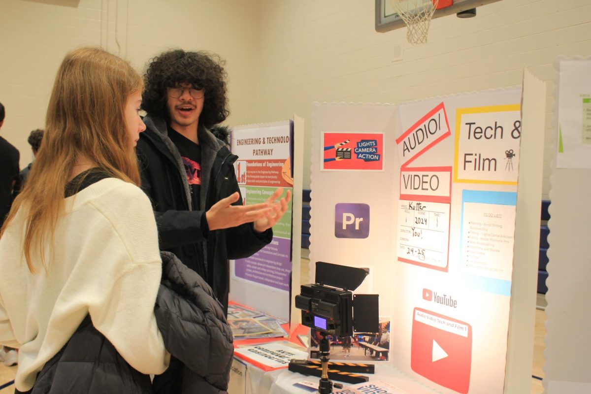 Sebastian Torres, 10, at the elective fair representing the tech & film and introducing the elective to Vera Skachkova ,8. 