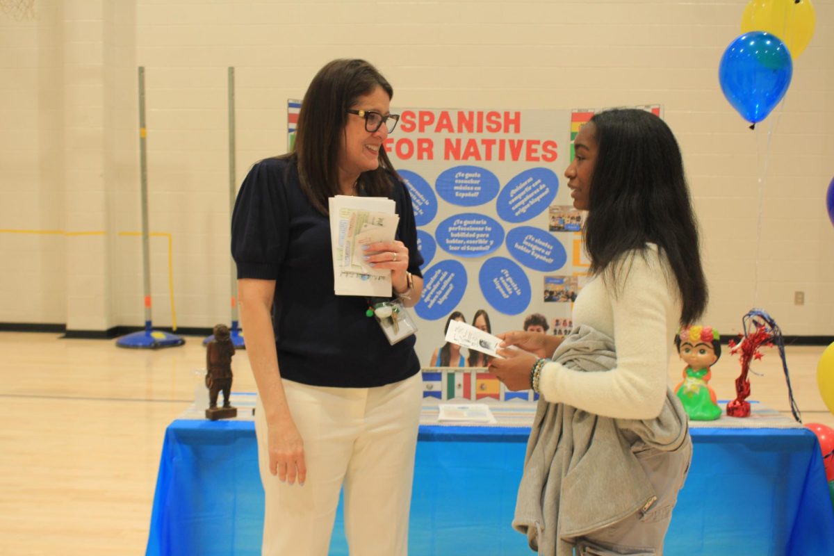 Maria Figueroa introducing Spanish for Natives to Chelsea Charles, 8. 