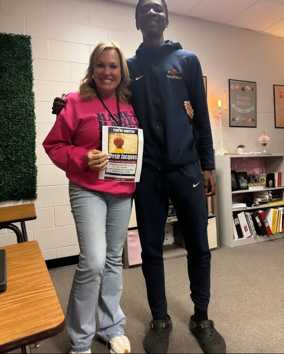 Desir Jacques, 11, giving Laura Harris with invitation to Teacher appreciation night. 