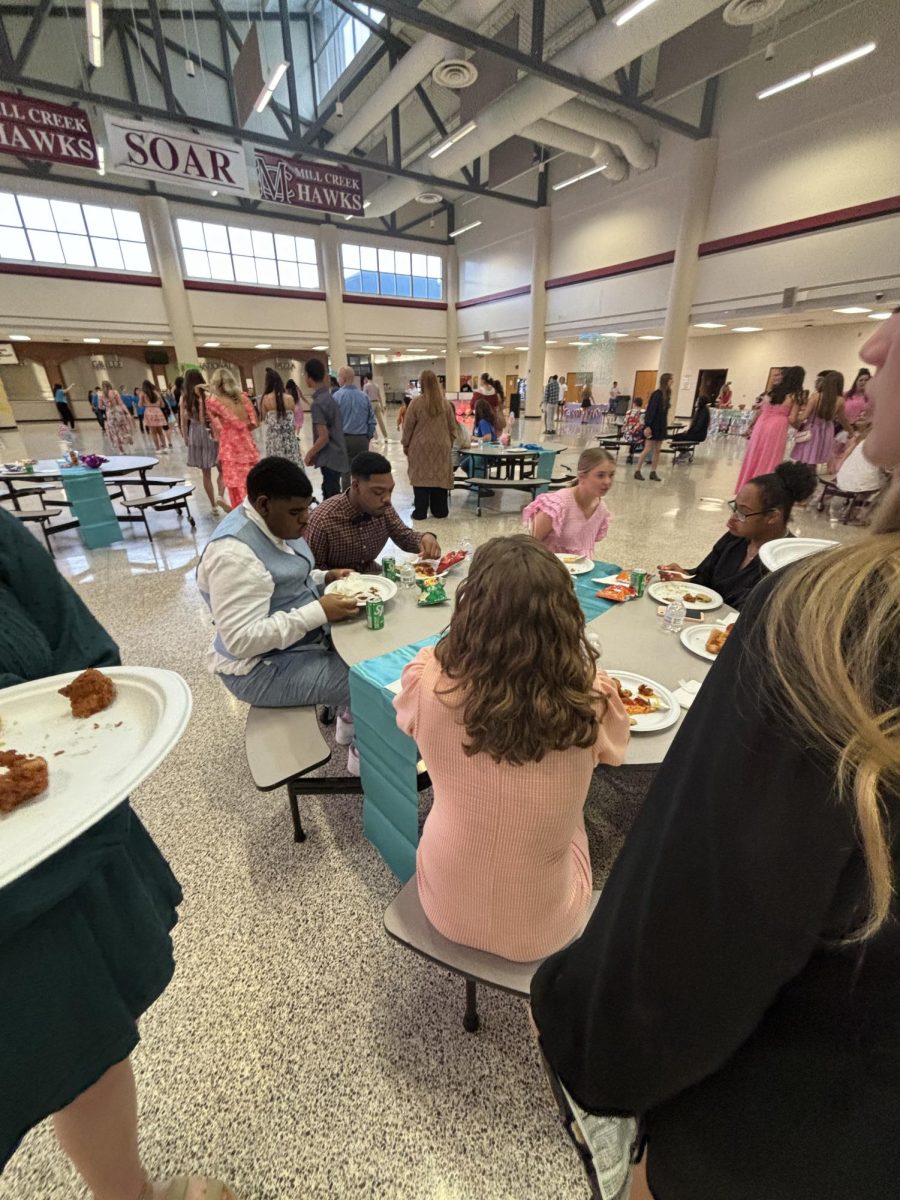 Mill Creek students gathered together and enjoying the snacks provided at the dance.