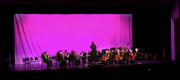 Philharmonic orchestra playing level four piece, To Tame the Raging Rapids by Balmages. Performed on Wednesday night, February 29th for the Pre-LGPE Concert. 