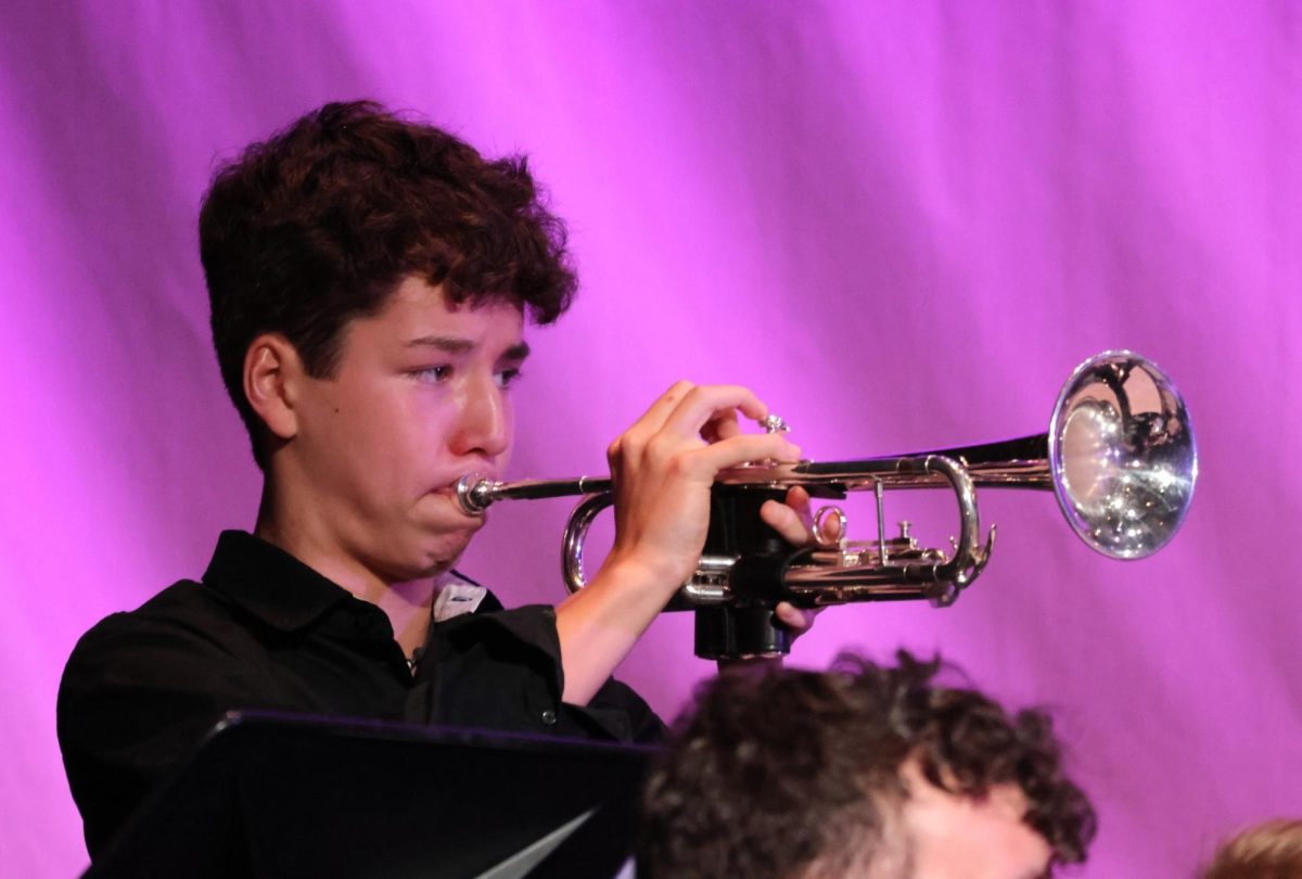 Band trumpet player, Brandon Kondo, 12, playing for the Band Spring Concert. 