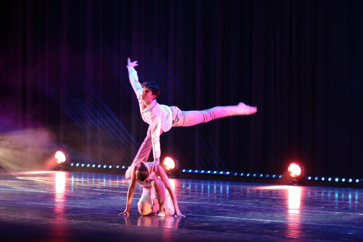 Cole Lovelady, 9, and Allie Hall, 12, performing to, "Love in the Dark," by Adele in Act II. 