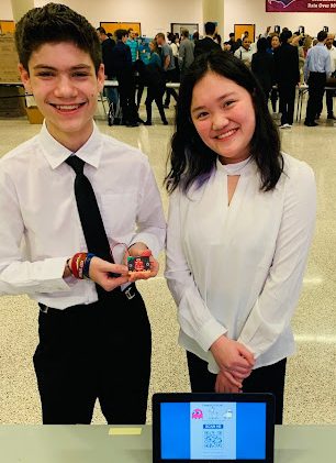 9th grade EPIC students Marco Dumitriu and Michela Chou present their Microbit project at EPIC Night on Feb. 27.
